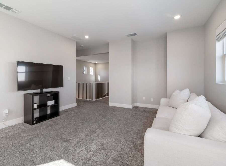 Discover modern living in this stylish property, featuring a spacious living area perfect for relaxation and entertainment.