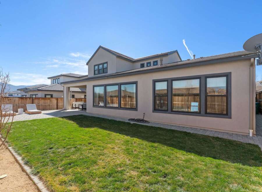 Enjoy the beauty of this stunning home with a spacious backyard, perfect for outdoor gatherings and relaxation.