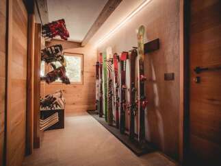 This stunning property boasts a dedicated ski storage area, perfect for winter enthusiasts.