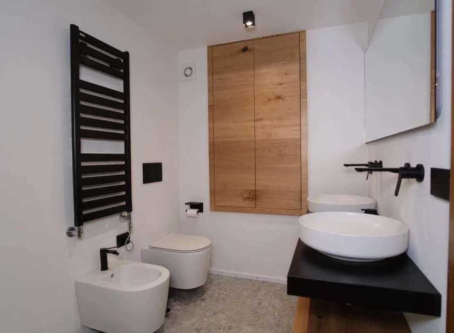 This modern bathroom showcases a sleek design with a focus on functionality and style.