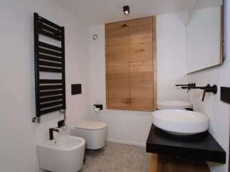 This modern bathroom showcases a sleek design with a focus on functionality and style.