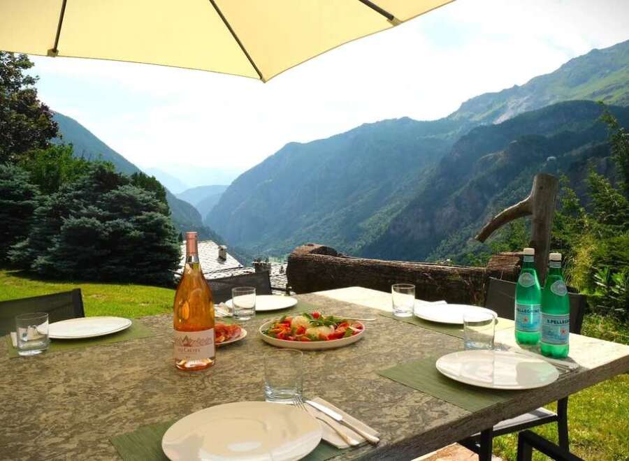 Enjoy breathtaking mountain views from this stunning outdoor dining area.