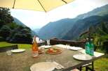 Enjoy breathtaking mountain views from this stunning outdoor dining area.