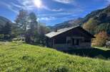Nestled in a picturesque mountain setting, this charming property offers a tranquil escape.