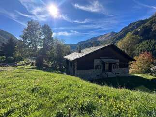 Nestled in a picturesque mountain setting, this charming property offers a tranquil escape.