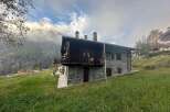 Nestled in a picturesque mountain setting, this charming stone house offers a tranquil escape.