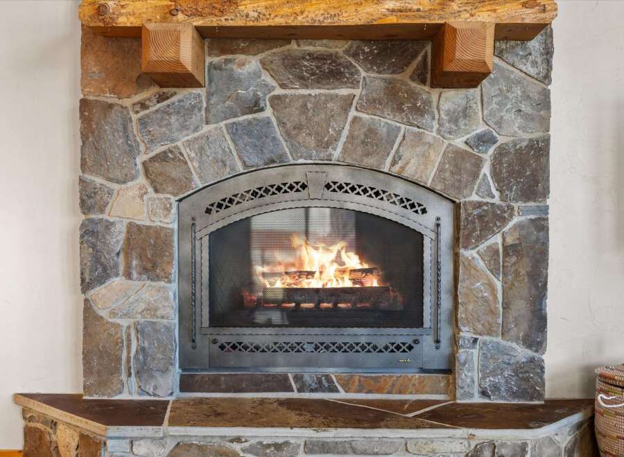 This stunning property boasts a beautiful stone fireplace, perfect for cozy evenings.