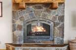 This stunning property boasts a beautiful stone fireplace, perfect for cozy evenings.