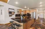 This stunning kitchen boasts a large island with a granite countertop, perfect for meal prep and entertaining.