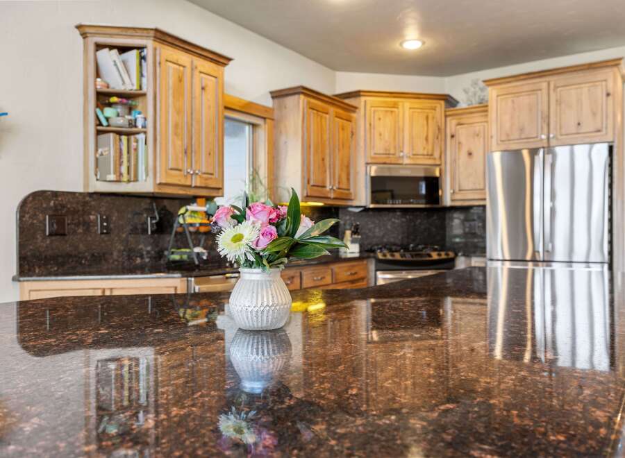 This stunning kitchen boasts beautiful wooden cabinetry, offering ample storage and a warm, inviting atmosphere.