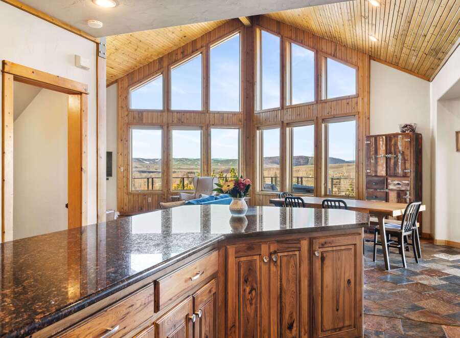 This stunning property boasts a spacious kitchen with a large island, perfect for entertaining.