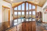 This stunning property boasts a spacious kitchen with a large island, perfect for entertaining.