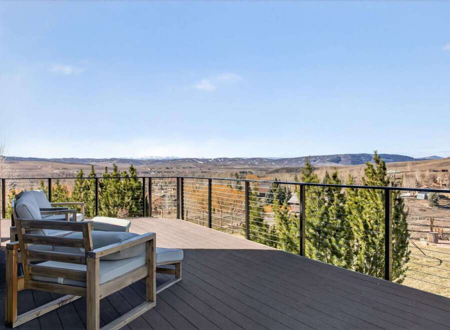 Enjoy breathtaking views from this stunning property! This home features a spacious deck, perfect for relaxing and entertaining.