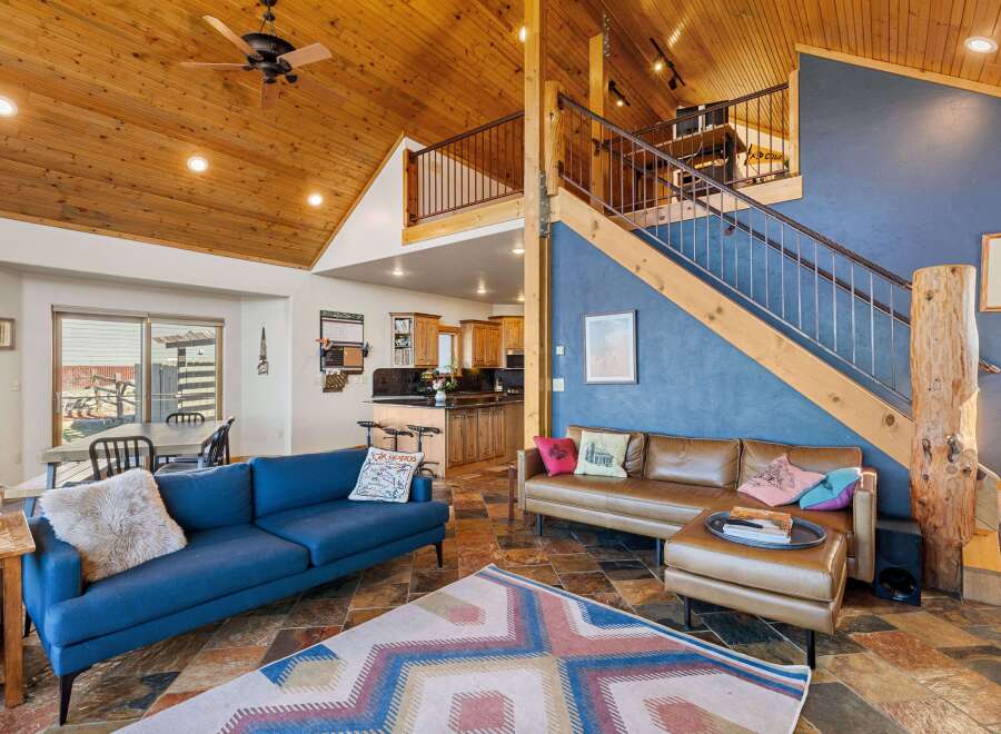 This stunning property boasts a warm and inviting interior with a unique blend of rustic and modern elements.