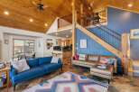 This stunning property boasts a warm and inviting interior with a unique blend of rustic and modern elements.