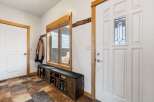 Step into this inviting entryway, showcasing a blend of rustic charm and modern design.