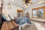 This charming bedroom offers a cozy retreat with its inviting ambiance and natural light.