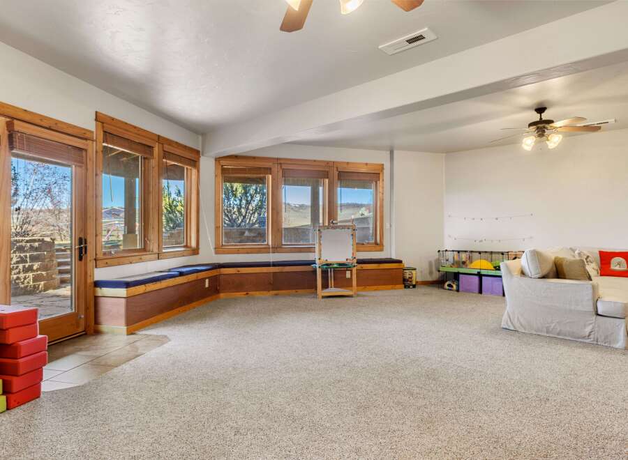 This spacious living area offers a bright and inviting atmosphere, perfect for relaxation and entertainment.