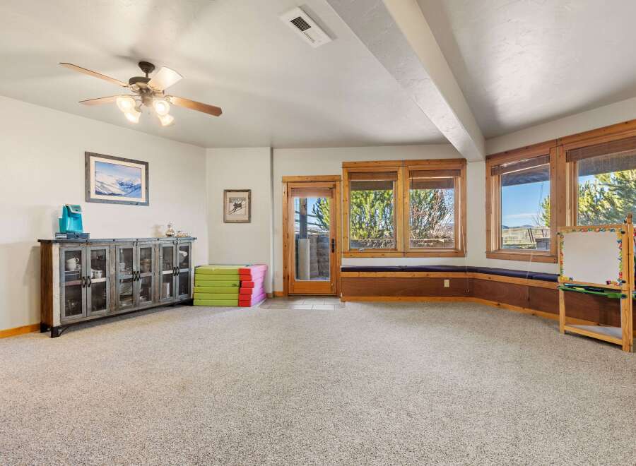 This spacious room offers a versatile space for various activities.