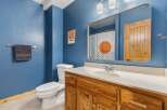 This charming bathroom features a stylish vanity with ample storage and a sleek countertop.