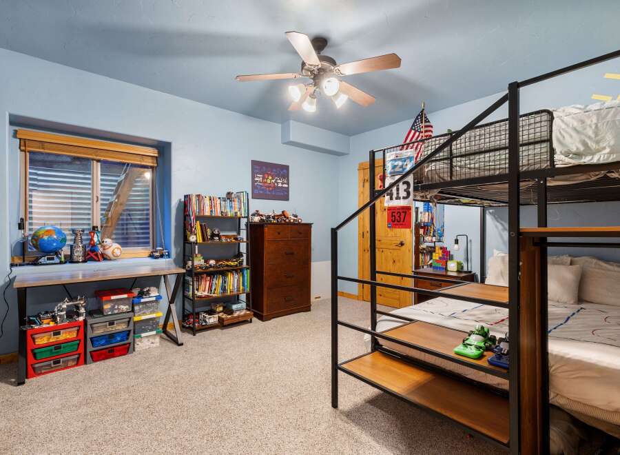 This cozy bedroom features a bunk bed, perfect for kids or guests.