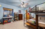 This cozy bedroom features a bunk bed, perfect for kids or guests.
