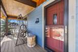 Step into the inviting embrace of this charming home, where a covered porch welcomes you with open arms.