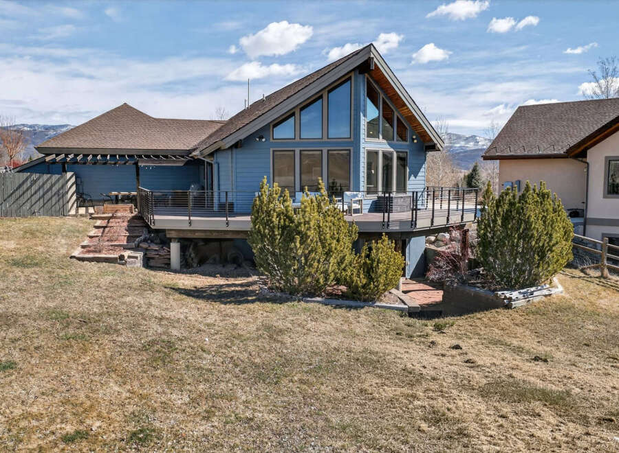 This stunning property boasts a modern design with a unique A-frame structure, offering ample natural light and breathtaking views.