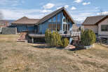 This stunning property boasts a modern design with a unique A-frame structure, offering ample natural light and breathtaking views.