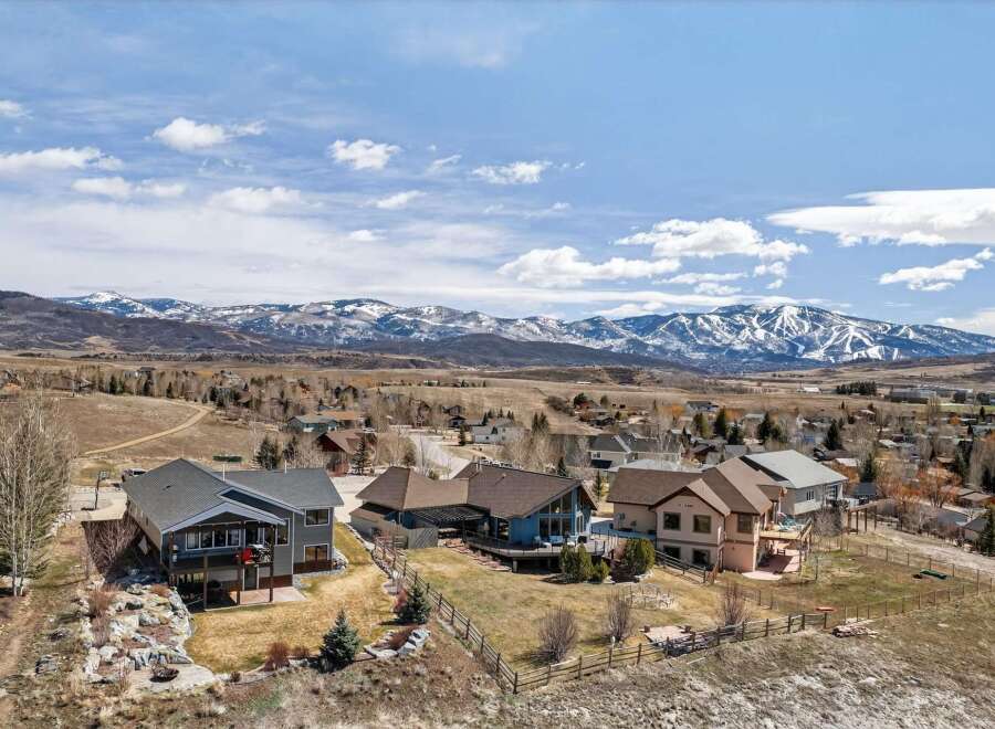 Discover your dream home in this stunning mountain retreat! This property boasts breathtaking views of the snow-capped mountains and offers a serene escape.