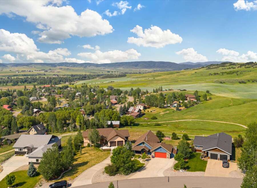 Discover this stunning property nestled in a picturesque landscape, offering breathtaking views of rolling green hills and distant mountains.
