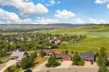 Discover this stunning property nestled in a picturesque landscape, offering breathtaking views of rolling green hills and distant mountains.