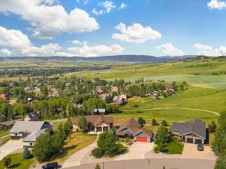 Discover this stunning property nestled in a picturesque landscape, offering breathtaking views of rolling green hills and distant mountains.