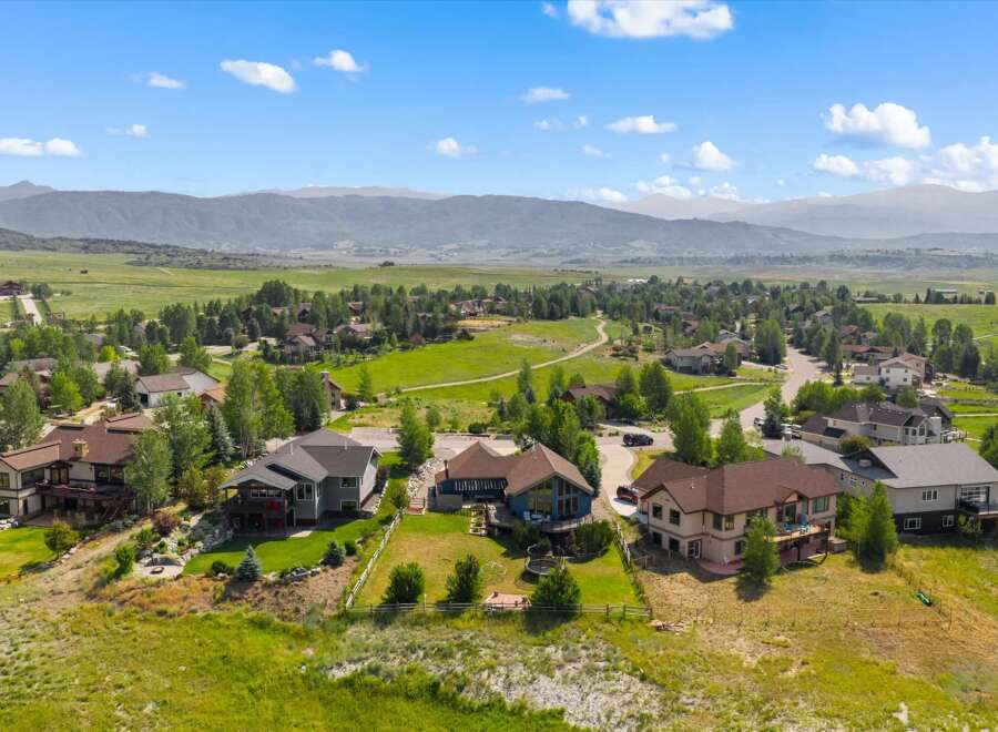 Experience luxury mountain living in this stunning property, boasting panoramic views of rolling hills and majestic mountains.