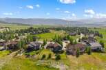 Experience luxury mountain living in this stunning property, boasting panoramic views of rolling hills and majestic mountains.