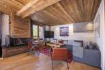 Experience the warmth and charm of this stunning living space, featuring a cozy fireplace and exquisite wooden accents.