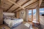 Experience the epitome of alpine luxury in this stunning bedroom.