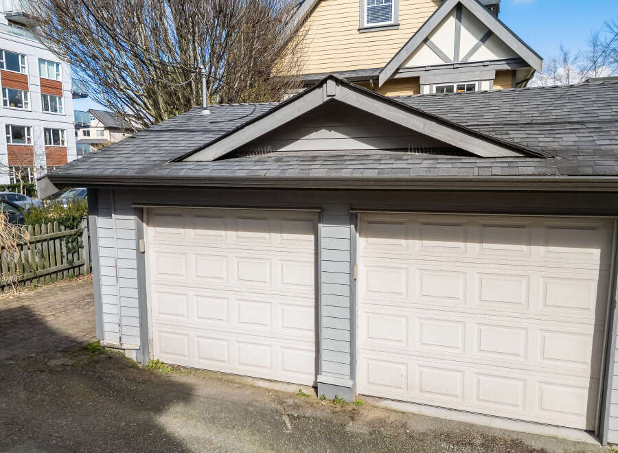 This charming property features a detached two-car garage, perfect for storing vehicles or providing extra space.