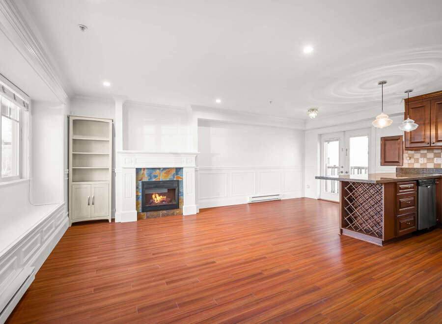 This stunning property boasts a spacious interior with a cozy fireplace, perfect for relaxing evenings.