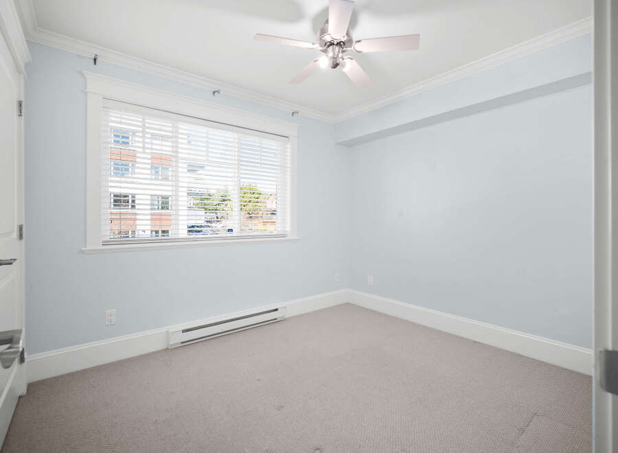 This inviting room features a neutral color palette, creating a serene and versatile space.