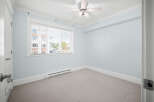 This inviting room features a neutral color palette, creating a serene and versatile space.