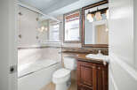 Step into this beautifully designed bathroom, featuring a modern glass shower enclosure and elegant tile work.