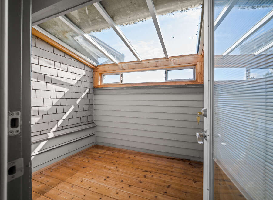 Step into this charming sunroom, a perfect blend of indoor comfort and outdoor serenity.