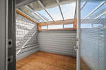 Step into this charming sunroom, a perfect blend of indoor comfort and outdoor serenity.