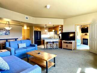 Step into luxury with this stunning property, featuring a spacious living area perfect for relaxation and entertainment.