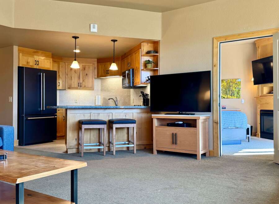 This stunning property boasts a modern kitchen with sleek appliances and ample counter space, perfect for culinary enthusiasts.