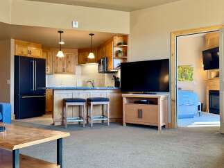 This stunning property boasts a modern kitchen with sleek appliances and ample counter space, perfect for culinary enthusiasts.