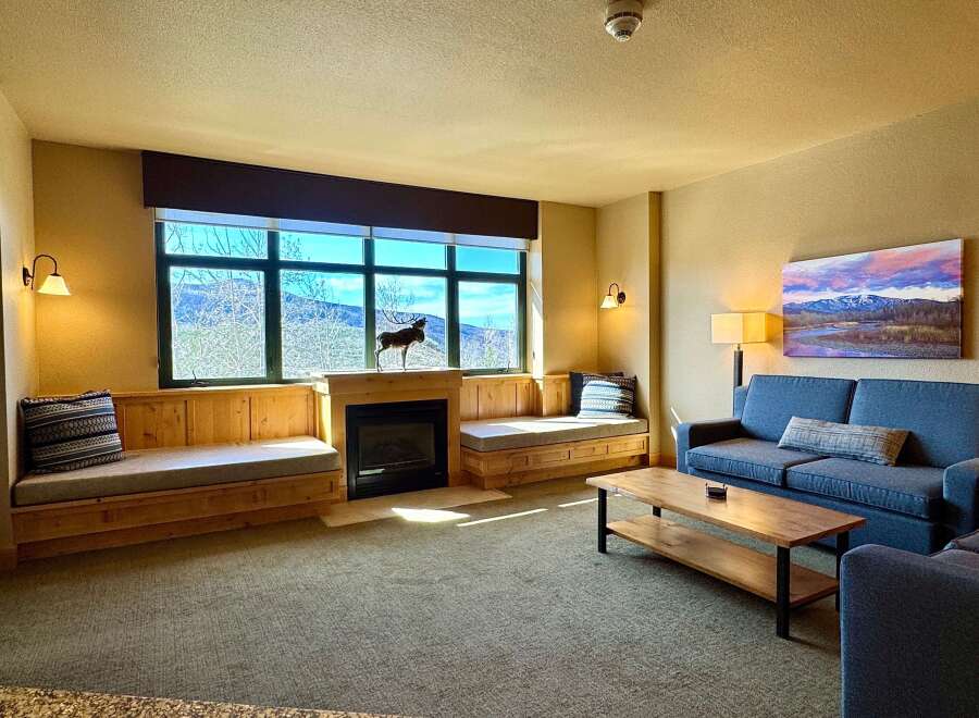 This stunning living room boasts a cozy fireplace, perfect for chilly evenings.