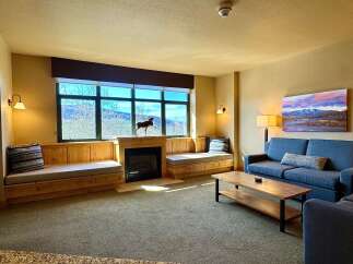 This stunning living room boasts a cozy fireplace, perfect for chilly evenings.