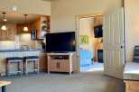 This cozy property features a well-equipped kitchen with modern appliances and a breakfast bar.